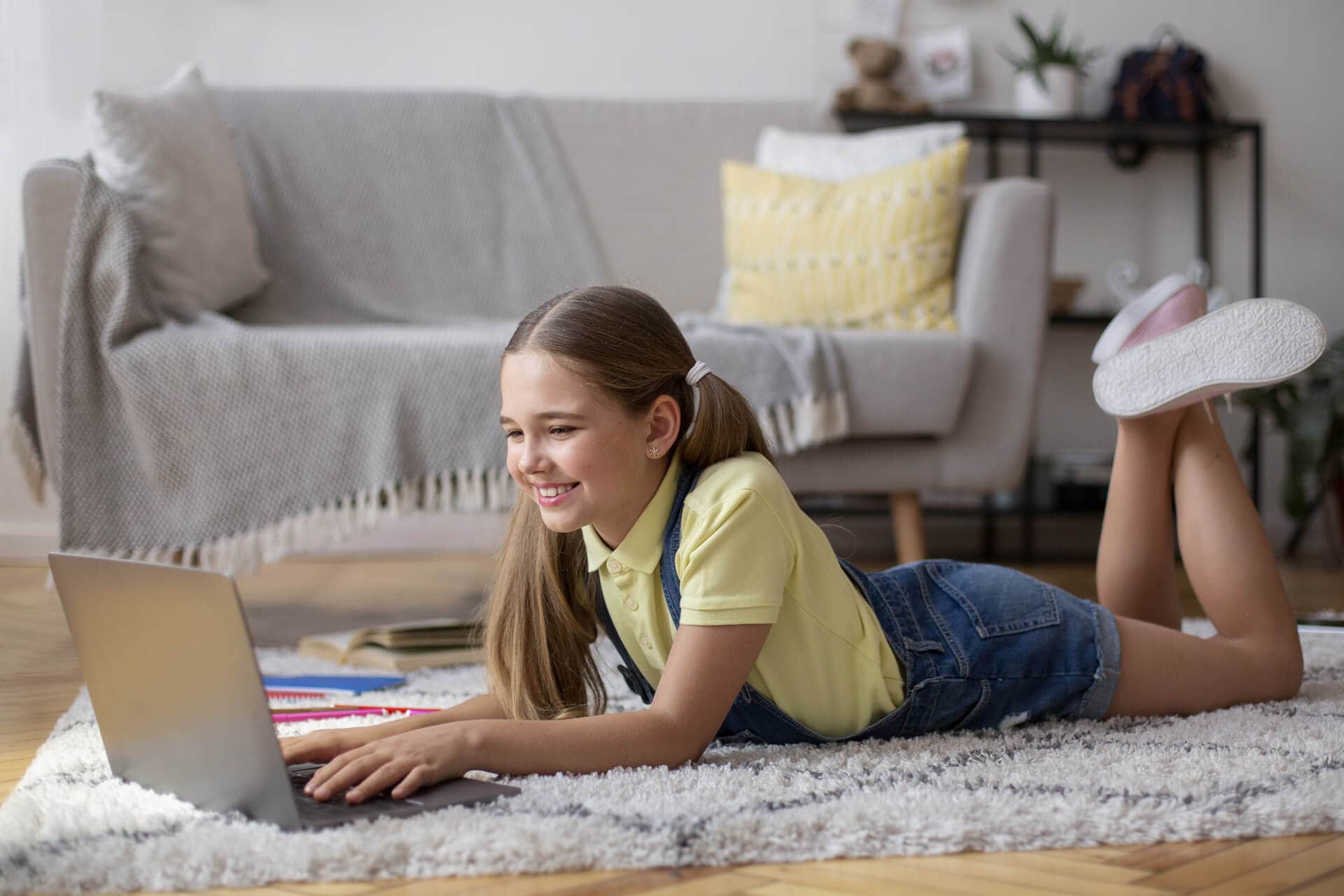 young woman on the floor in her laptop